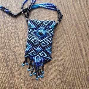 Beaded necklace with little pouch